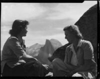Carolyn Bartlett and young woman seated at Glacier Point, Yosemite National Park, 1941