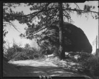 Mrs. Tom Carlisle and rock formation, Riverside County, [1920-1939?]