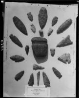 Display of mounted Indian artifacts including arrowheads and stones, Palos Verdes Estates, 1930 or 1931