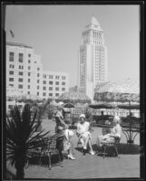 Margaret Schulze and two women on patio near Los Angeles City Hall, Los Angeles, 1932