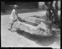 Carolyn Bartlett and stone water trough, Olvera Street, Los Angeles, 1931