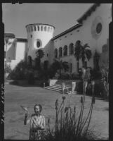 Carolyn Bartlett in courtyard, Santa Barbara County Courthouse, Santa Barbara, 1933