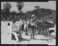 Group on beach with kite, Santa Barbara, 1933