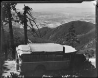 Bus on road overlooking San Bernardino Valley, near Lake Arrowhead, 1929