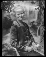 Mary Van Ness Leavitt posing in her garden, Santa Monica, 1928