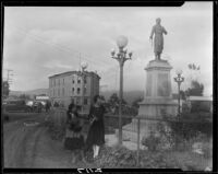View of street in Ensenada with statue of Miguel Hidalgo, Ensenada, 1931