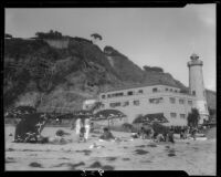 Lighthouse-shaped building on Will Rogers State Beach, beach, and cliffs, Pacific Palisades, 1930