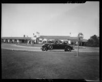 Man in car in front of Virginia Country Club, Long Beach, 1929