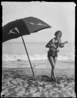 Woman on beach with ukulele, Long Beach, 1929
