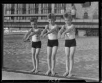 Identical triplet sons of politician George W. Neal posing at the beach, Santa Monica, circa 1930's