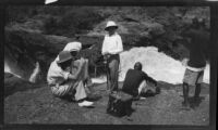 Margaret Rotha, Horace Wheddon and guides at a Victoria Nile River cascade during a journey to Murchison Falls, Uganda, 1933