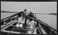 Ugandan workers rowing a whale boat transporting Paul Rotha and party on Lake Albert on a journey to Murchison Falls, Uganda, 1933