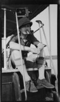 Filmmaker Paul Rotha seated aboard the tugboat S.S. Livingston on Lake Albert during a journey to Murchison Falls, Uganda, 1933