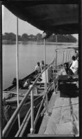 Ugandan workers aboard the tugboat S.S. Livingston on Lake Albert, during the journey of Filmmaker Paul Rotha and his party to Murchison Falls, Uganda, 1933
