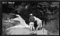 Filmmaker Paul Rotha and cameraman Horace Wheddon filming a waterfall on the Thika River, Thika, 1932