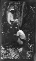 Filmmaker Paul Rotha, guide Drysdale and Ugandan stopped near the Victoria Nile River, Uganda, 1933