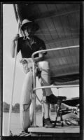 Filmmaker Paul Rotha seated aboard the tugboat S.S. Livingston on Lake Albert during a journey to Murchison Falls, Uganda, 1933