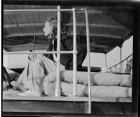 Margaret Rotha seated aboard the tugboat S.S. Livingston on Lake Albert during a journey to Murchison Falls, Uganda, 1933