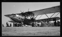 Imperial Airways plane Hadrian on the  ground for maintenance or loading during the filming of Contact, [Karachi?], 1932-1933