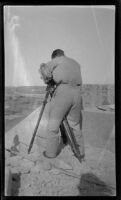 Filmmaker Paul Rotha photographing a valley, Aswān or Cairo, Egypt, 1932