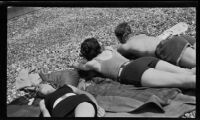 Margaret Rotha, woman, and man sunbathing, England, 1932-1933