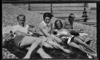 Margaret Rotha and 2 women and 1 man sunbathing, England, [1932-1933]