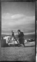 Cameraman Frank Goodliffe in front of the Propylaea during the filming of Contact, Athens, 1933