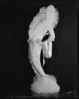Peggy Hamilton modeling a Max Rée hostess gown with a tulle collar, 1928