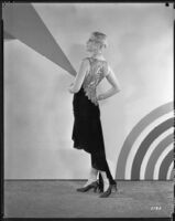 Peggy Hamilton modeling an Adrian cocktail dress (probably by Adrian), 1929
