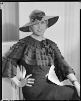 Peggy Hamilton modeling a navy blue dress in grenadine crepe, 1933