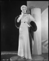 Peggy Hamilton modeling a Max Rée gown in ivory and black satin, 1931