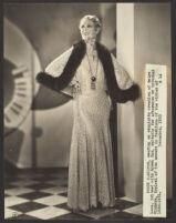 Peggy Hamilton modeling a long lace dress from Jean Swartz's Fashion Salons, 1930