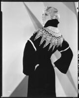 Peggy Hamilton modeling an Adrian coat called the "Eskimo Embroidered coat" (probably by Adrian), 1929