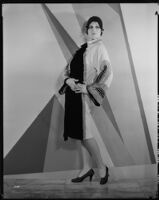 Peggy Hamilton modeling an Adrian coat of black chiffon velvet and cream broadcloth, 1929