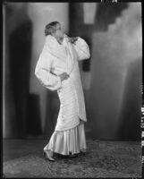 Peggy Hamilton modeling a white ermine coat, 1929