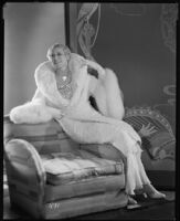 Peggy Hamilton modeling an ermine coat chiffon evening gown, 1931