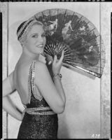 Peggy Hamilton modeling an Earl Luck blue sequin dinner gown and cap, 1931