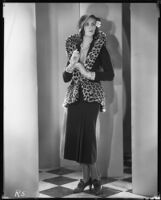Peggy Hamilton modeling a suit of brown velvet velour trimmed with baby leopard, 1930