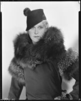 Peggy Hamilton modeling a coat, fur stole and hat, 1933