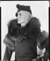 Peggy Hamilton modeling a coat, fur stole and hat, 1933