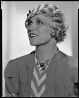 Peggy Hamilton modeling a striped cap with a matching dress, circa 1933