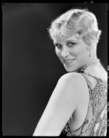 Peggy Hamilton modeling an Adrian cocktail dress (probably by Adrian), 1929