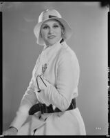 Peggy Hamilton modeling a Beaudine Hat with a sports ensemble in white angora wool, 1931