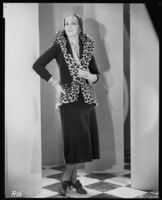 Peggy Hamilton modeling a suit of brown velvet velour, 1930