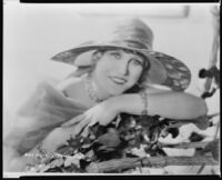 Peggy Hamilton modeling a large-brim hat, 1932