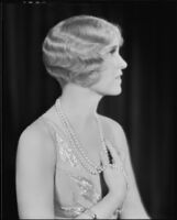 Peggy Hamilton modeling a hairstyle and dance frock decorated with bugle beads and rhinestones, 1930