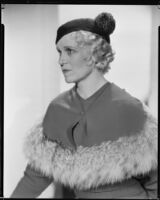 Peggy Hamilton modeling a dress with a matching fur-trimmed capelette, circa 1933