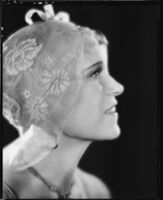 Peggy Hamilton modeling a floral net cloche, 1930