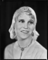 Peggy Hamilton modeling a floral net cloche, 1930
