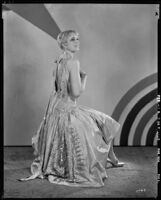 Peggy Hamilton modeling an Adrian taffeta evening gown (probably by Adrian), 1929